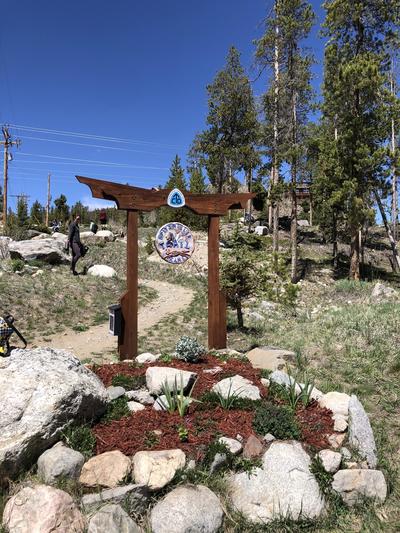 An archway stands at the entrance to the CDT in Grand Lake