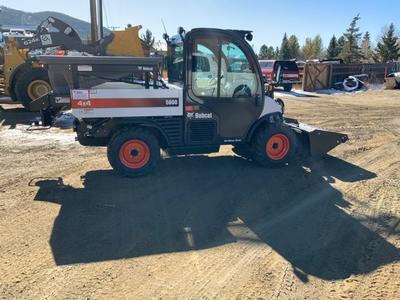 Staff driving toolcat in downtown Grand Lake
