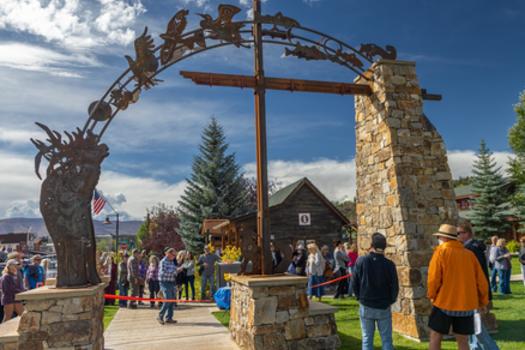 A ribbon cutting ceremony for the new Town Park marquee featuring a stunning metalwork archway